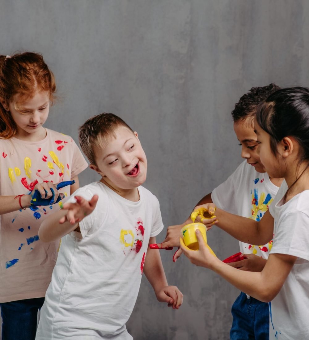 Happy kids with finger colours painting t-shirts. Happy kids with finger colours painting t-shirts.